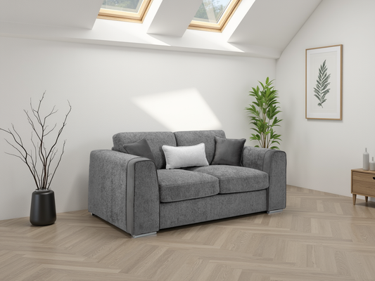 Gray sofa in a modern living room with skylights and plants.