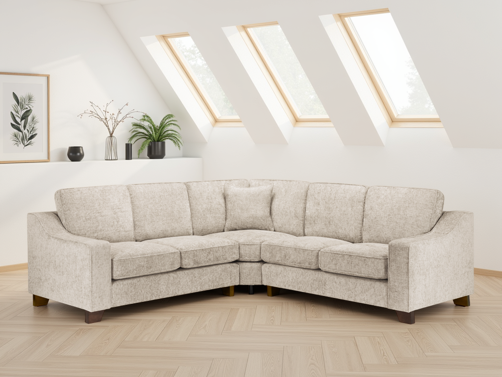 Beige sectional sofa in a room with skylights and decorative plants.