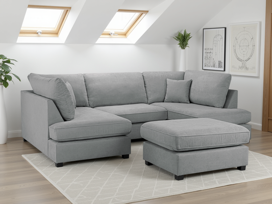 Gray sectional sofa in a living room with skylights and decorative elements.