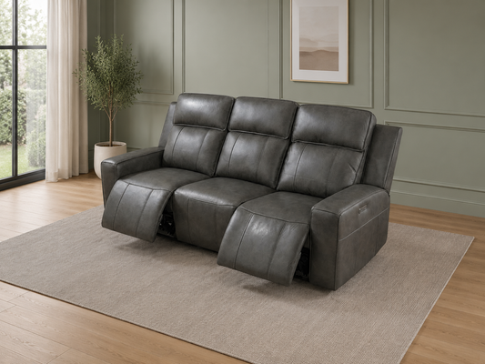 Gray leather sofa with large windows.