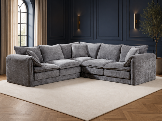 Gray sectional sofa in a modern living room with a beige carpet.