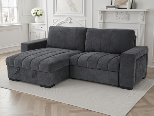 Gray sectional sofa in a living room setting with a fireplace and window.