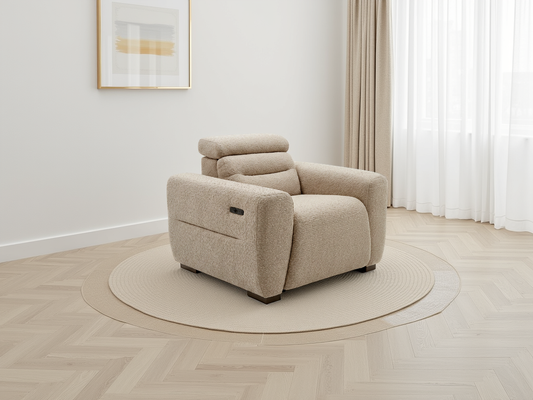 Beige recliner chair in a room with light wood flooring and white walls.