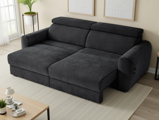 Black sectional sofa in a living room setting with a coffee table and decor items.