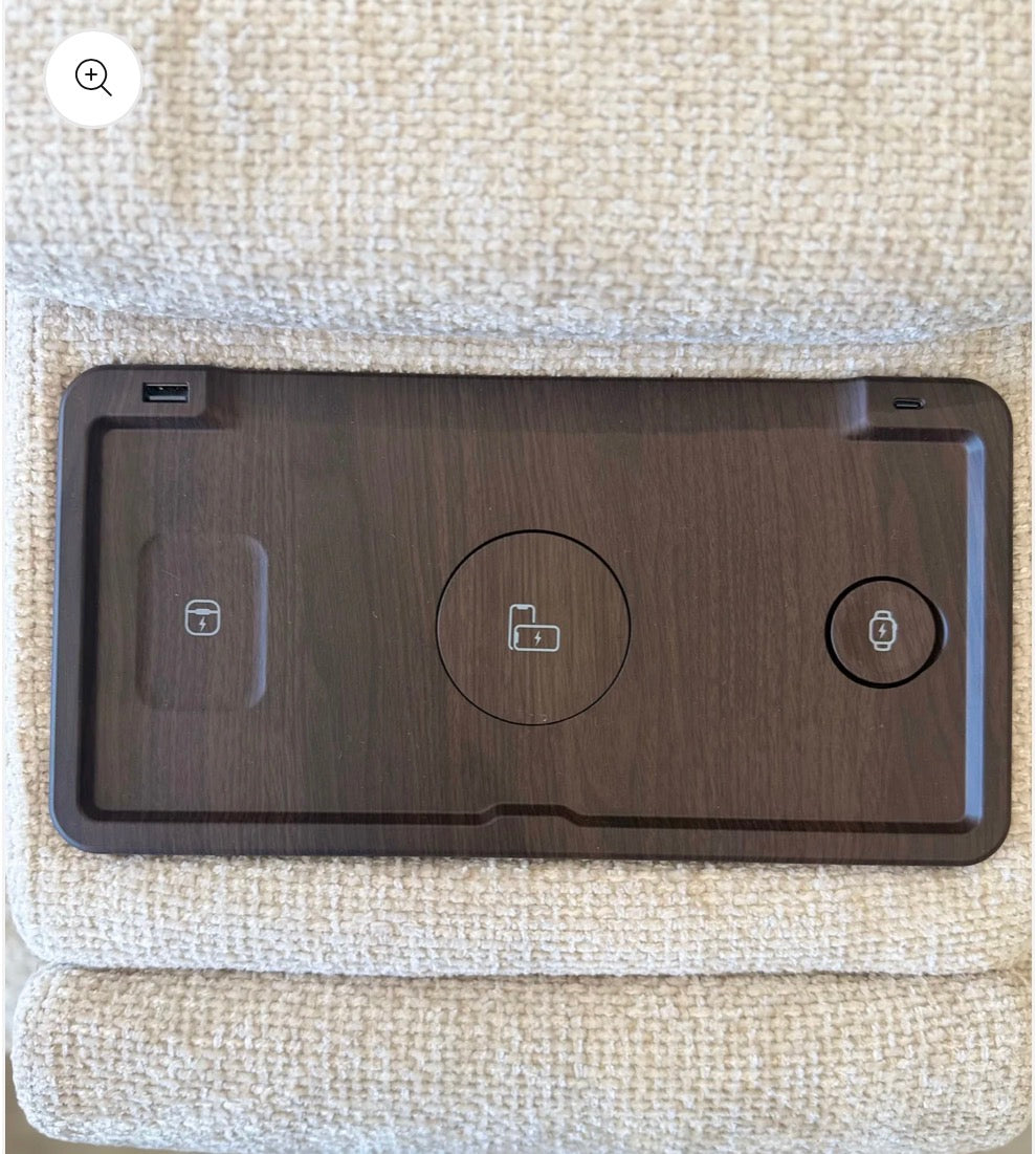 A dark brown wood-grain tablet protective skin or case with a matte finish, featuring a USB-C port on the top left and three circular cutouts for phone accessories, displayed on a beige textured fabric surface.