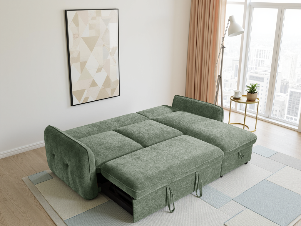 Green sofa bed in a room with a painting on the wall and a window.