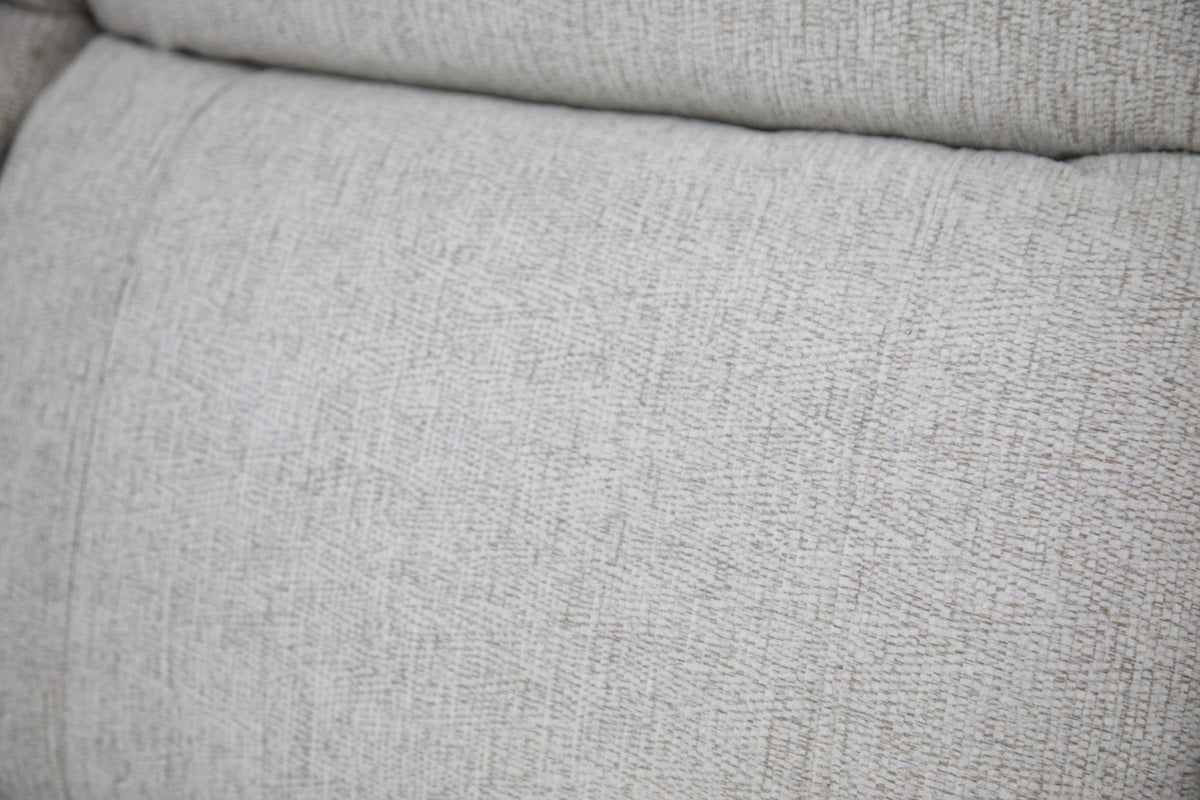 Close-up of a textured beige fabric surface