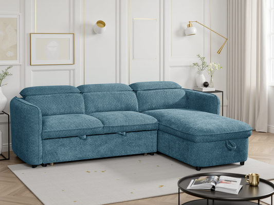 Blue sectional sofa in a living room setting with decor elements.