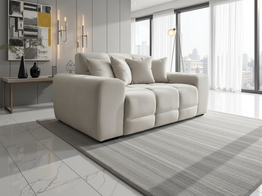 Beige sofa in a modern living room with large windows and decorative elements.