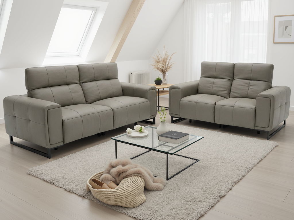 A modern living room setup featuring a light gray three-seater sofa and a matching two-seater loveseat with black metal legs.