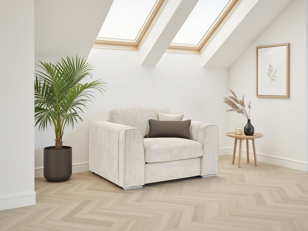 Modern living room with a white armchair, plant, and small table.