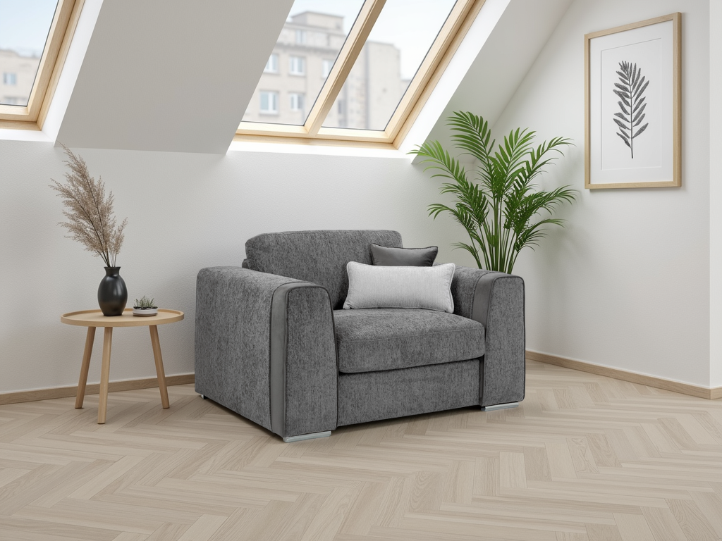 Gray armchair in a room with wooden flooring, a small table, and plants.