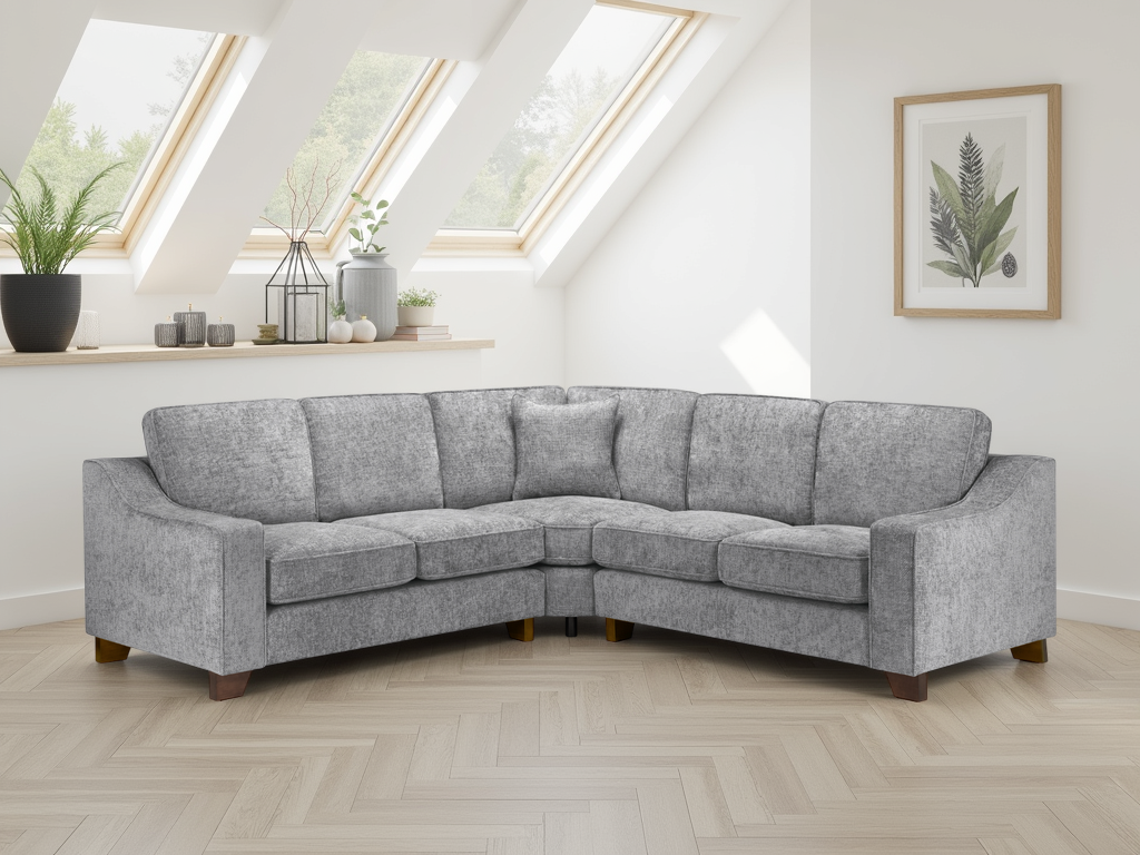 Gray sectional sofa in a room with skylights and decorative plants.