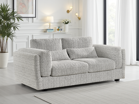 Gray sofa in a living room with decor elements.