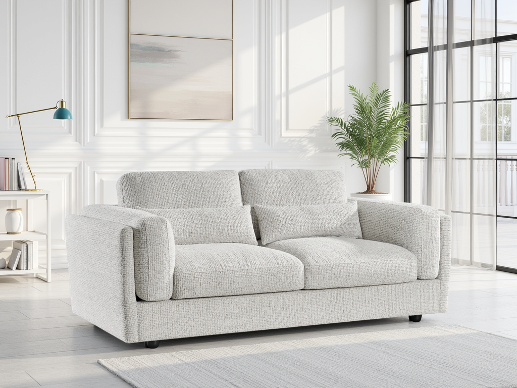 Beige sofa in a modern living room with large windows and a plant.