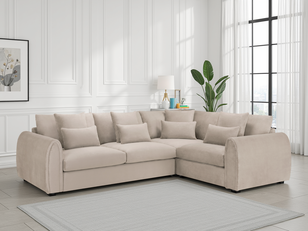 Beige sectional sofa in a living room with white walls and large windows.