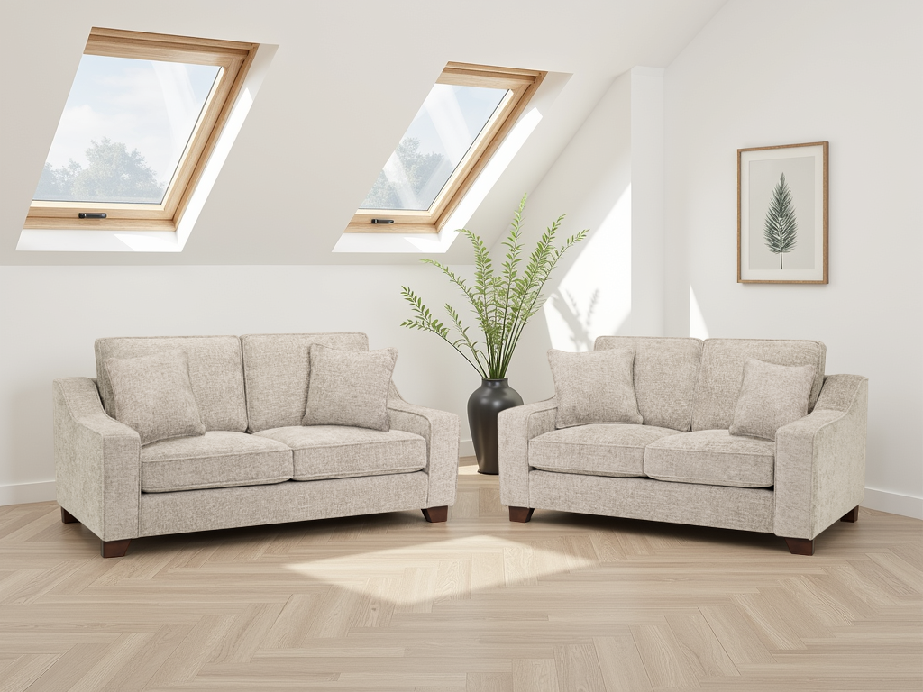Two beige sofas in a living room with skylights and a plant.