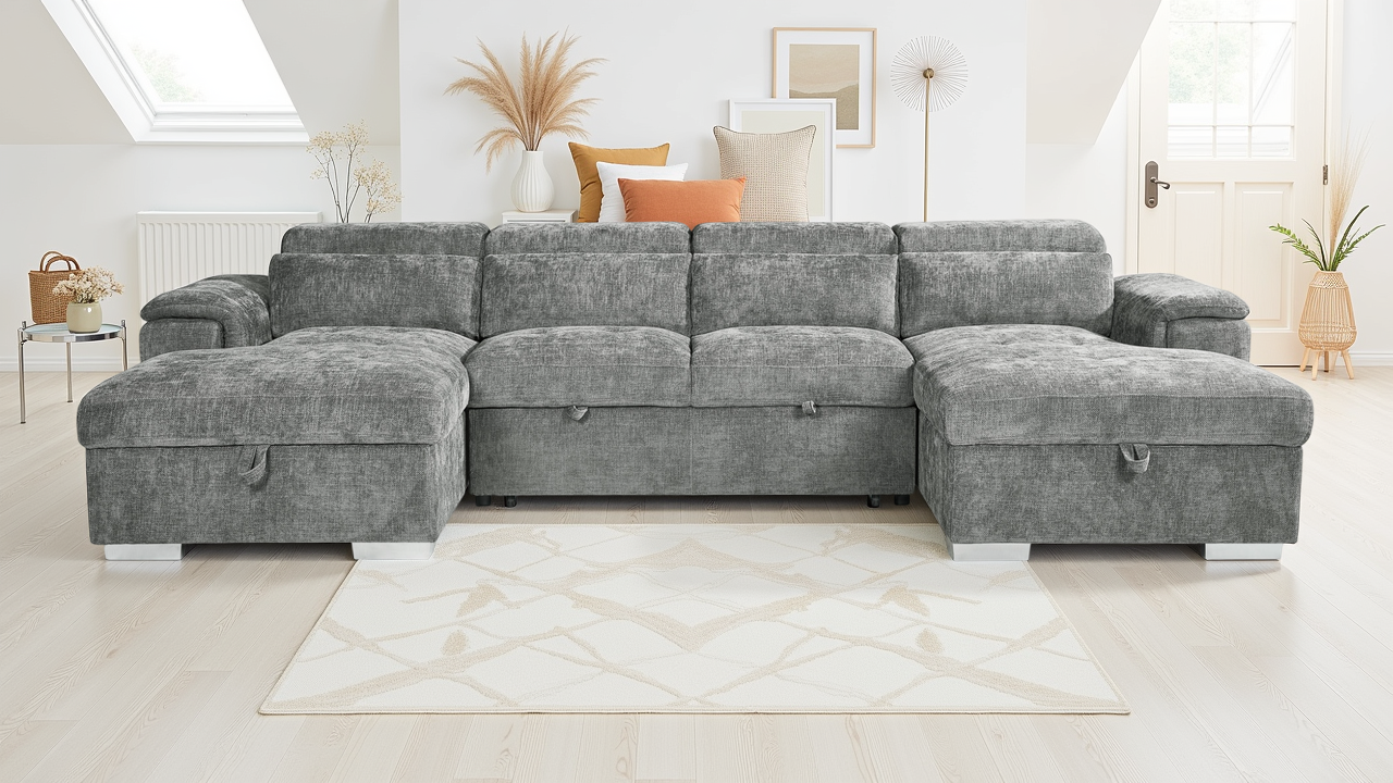 Gray sectional sofa in a living room setting with decor elements.