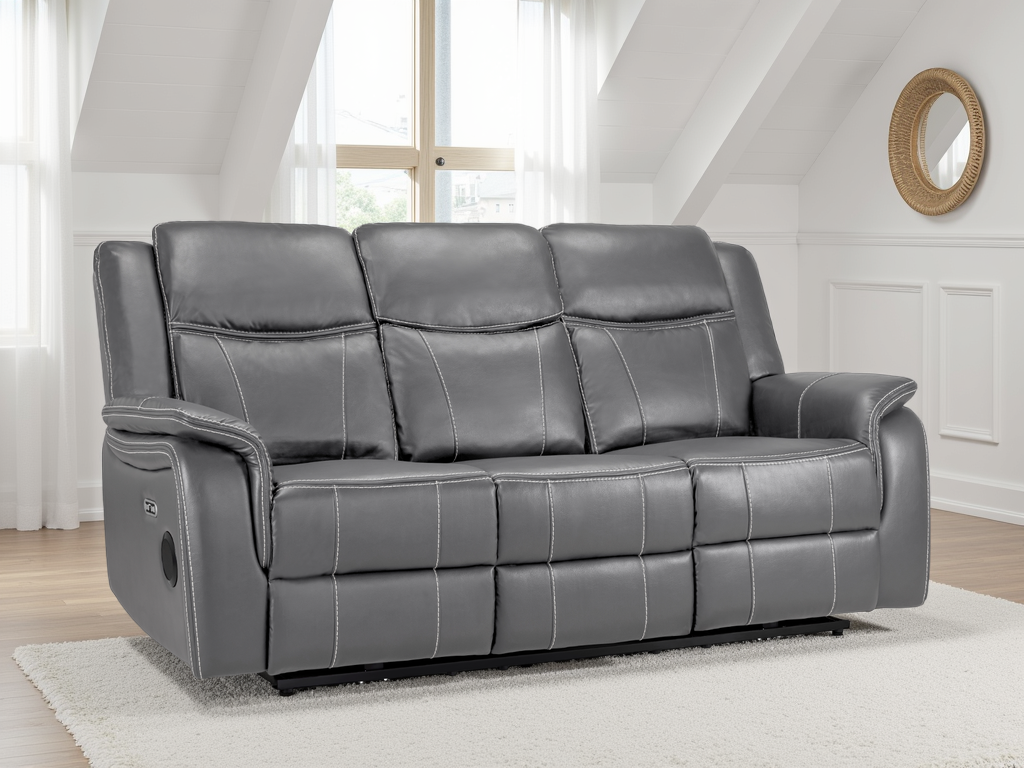 Gray leather sofa in a living room setting with white walls and a window.