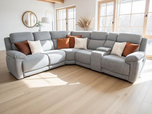Gray sectional sofa with colorful cushions in a bright living room.