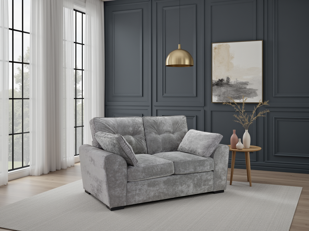 Gray sofa in a living room with dark paneled walls, a gold pendant light, and a small table with decorative items.