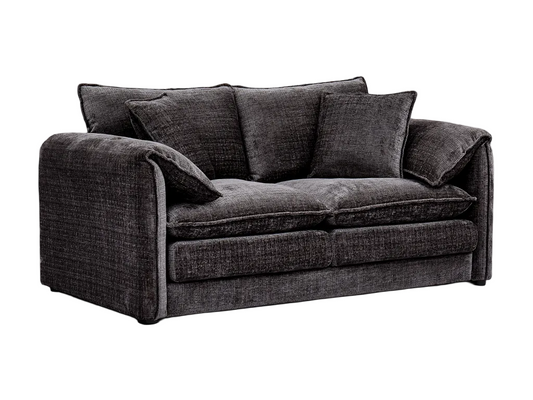 Black sofa with cushions on a white background