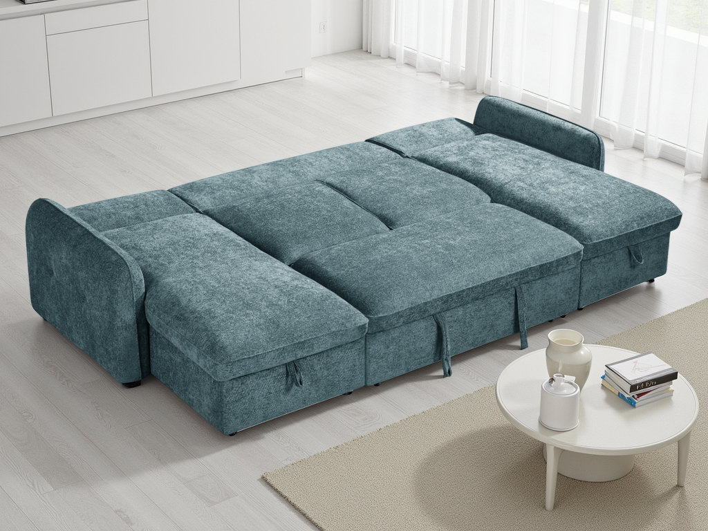 Blue sectional sofa in a modern living room with a small table and decor items.