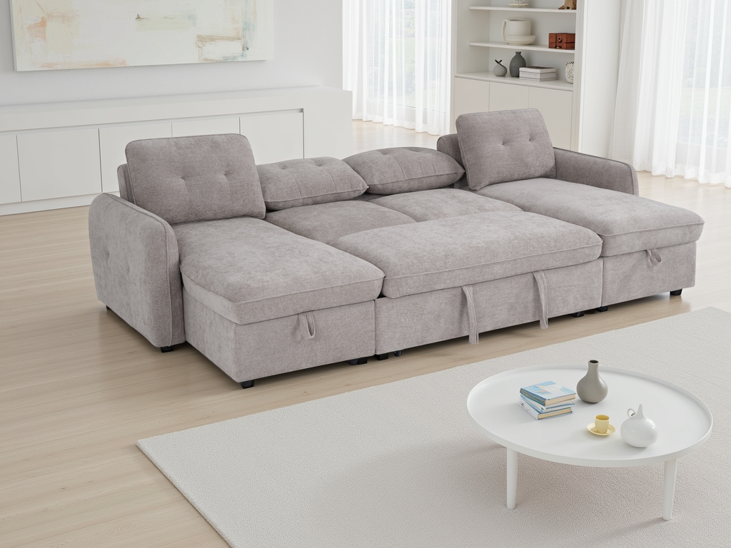 Beige sectional sofa in a living room with a small round table and decor items.