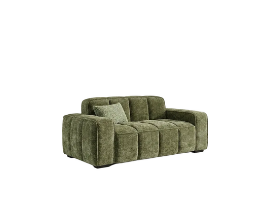 A modern two-seater sofa upholstered in textured olive green fabric, featuring a tufted backrest and armrests, with a matching green throw pillow, shown against a plain white background.