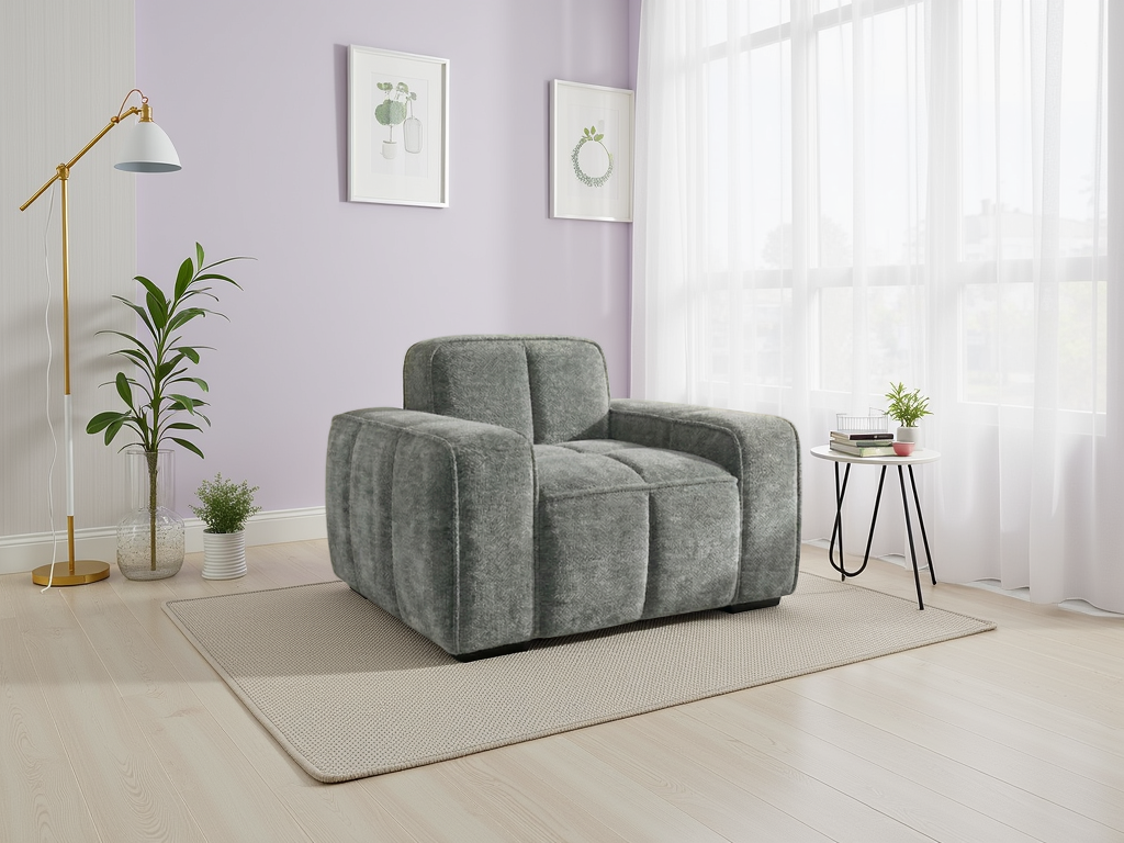 Gray armchair in a modern living room with a purple wall, floor lamp, and small table.