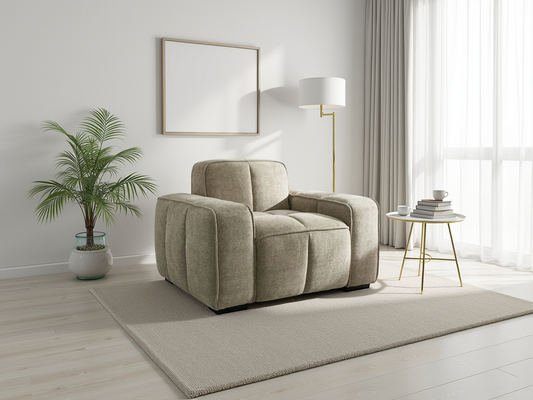 Beige armchair in a modern living room with a plant and side table.