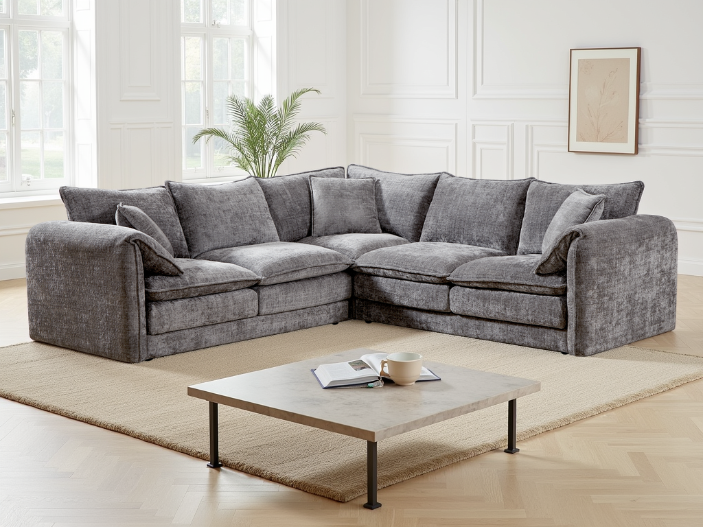 Gray sectional sofa in a modern living room with a coffee table and decor.