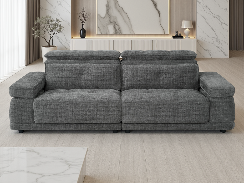 A modern gray fabric sectional sofa with tufted back cushions, shown in a bright, contemporary living room with light wood floors and marble accents.