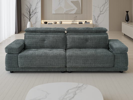 A modern two-seater sofa upholstered in textured gray fabric, positioned in a contemporary living room.