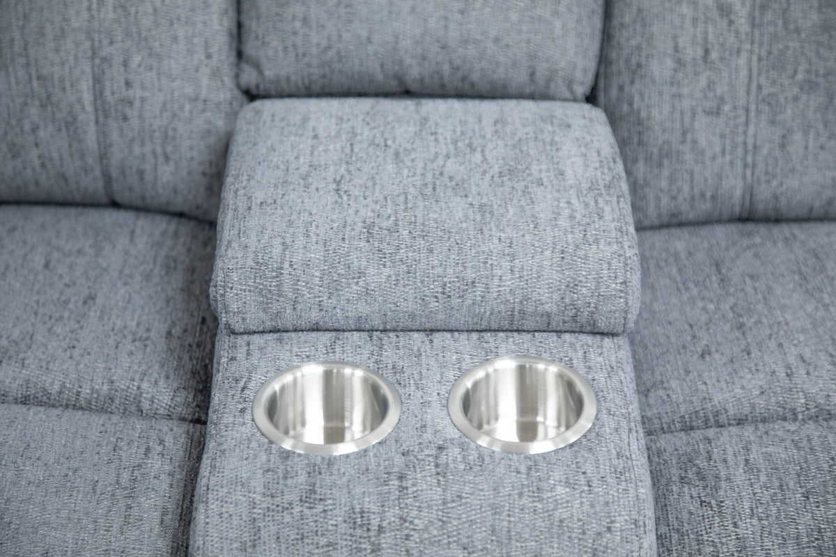 Two metallic cup holders embedded in a gray upholstered surface.