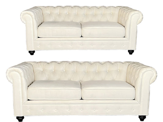 Two matching tufted armchairs in off-white leather, shown from the front on a plain white background.