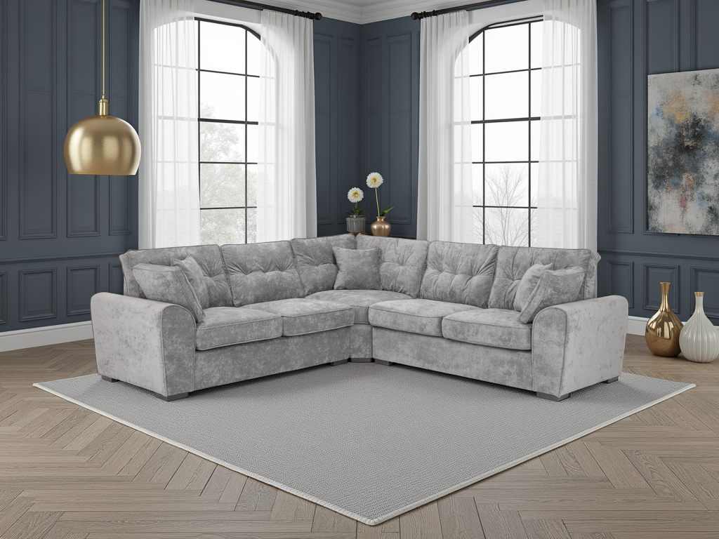 Gray sectional sofa in a living room with large windows and decorative elements.