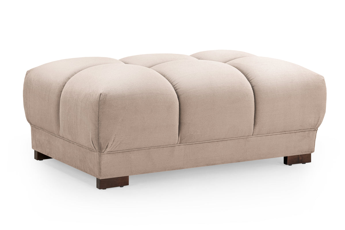 Beige ottoman with tufted design on a white background
