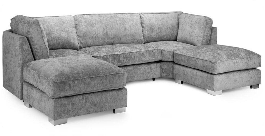 A gray upholstered sectional sofa with a chaise lounge on the left and a matching ottoman, shown on a plain white background.