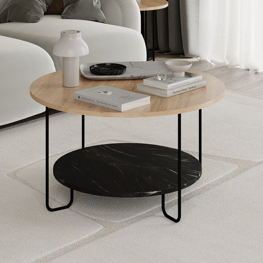Round coffee table with wooden top and black marble shelf in a living room setting.