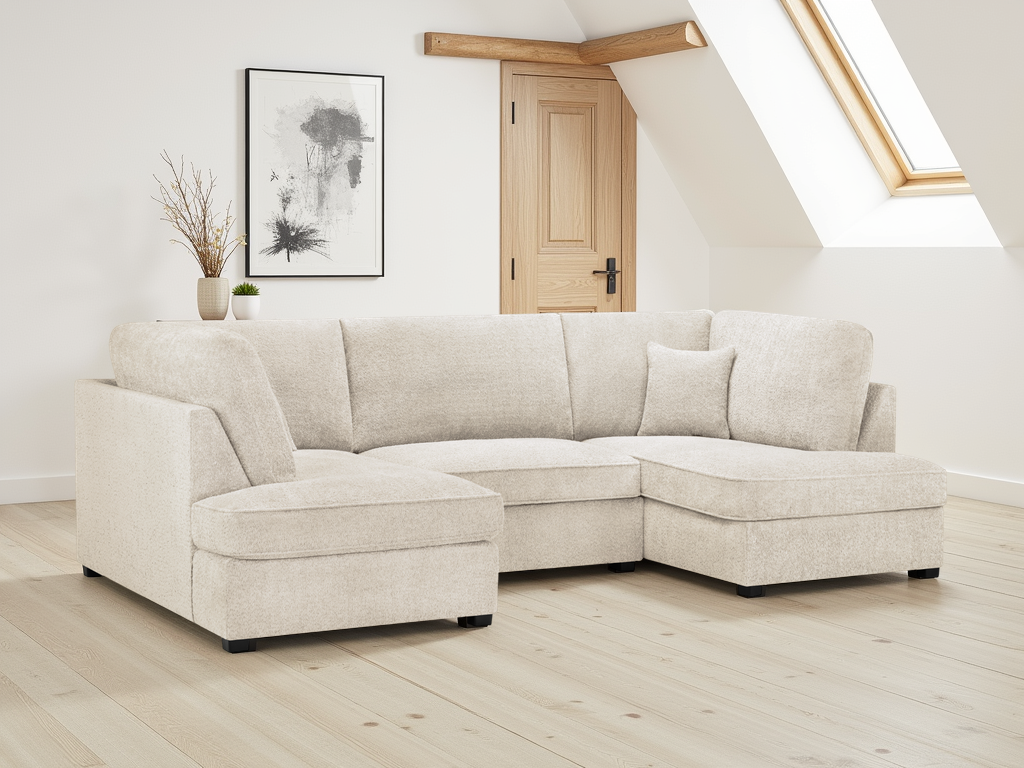Beige sectional sofa in a room with wooden floor and white walls.