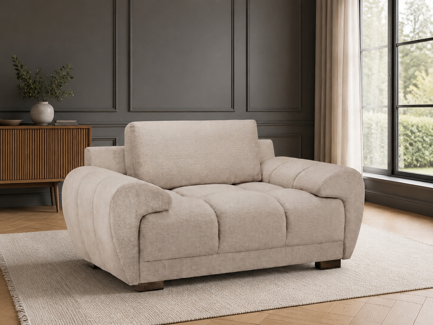 Beige sofa in a room with large windows