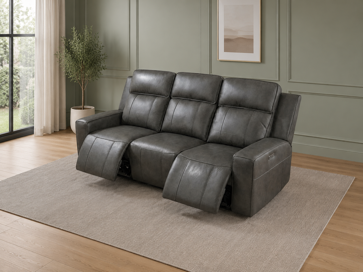 Gray leather sofa with large windows.