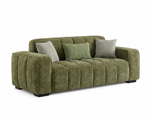 A green tufted fabric sofa with three decorative throw pillows, shown from a three-quarter angle on a solid white background.
