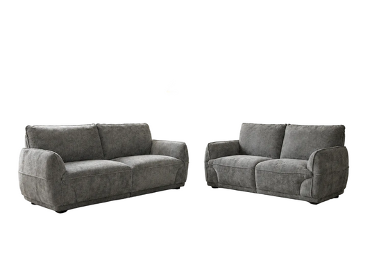 A gray upholstered loveseat and matching armchair shown side by side on a plain white background.