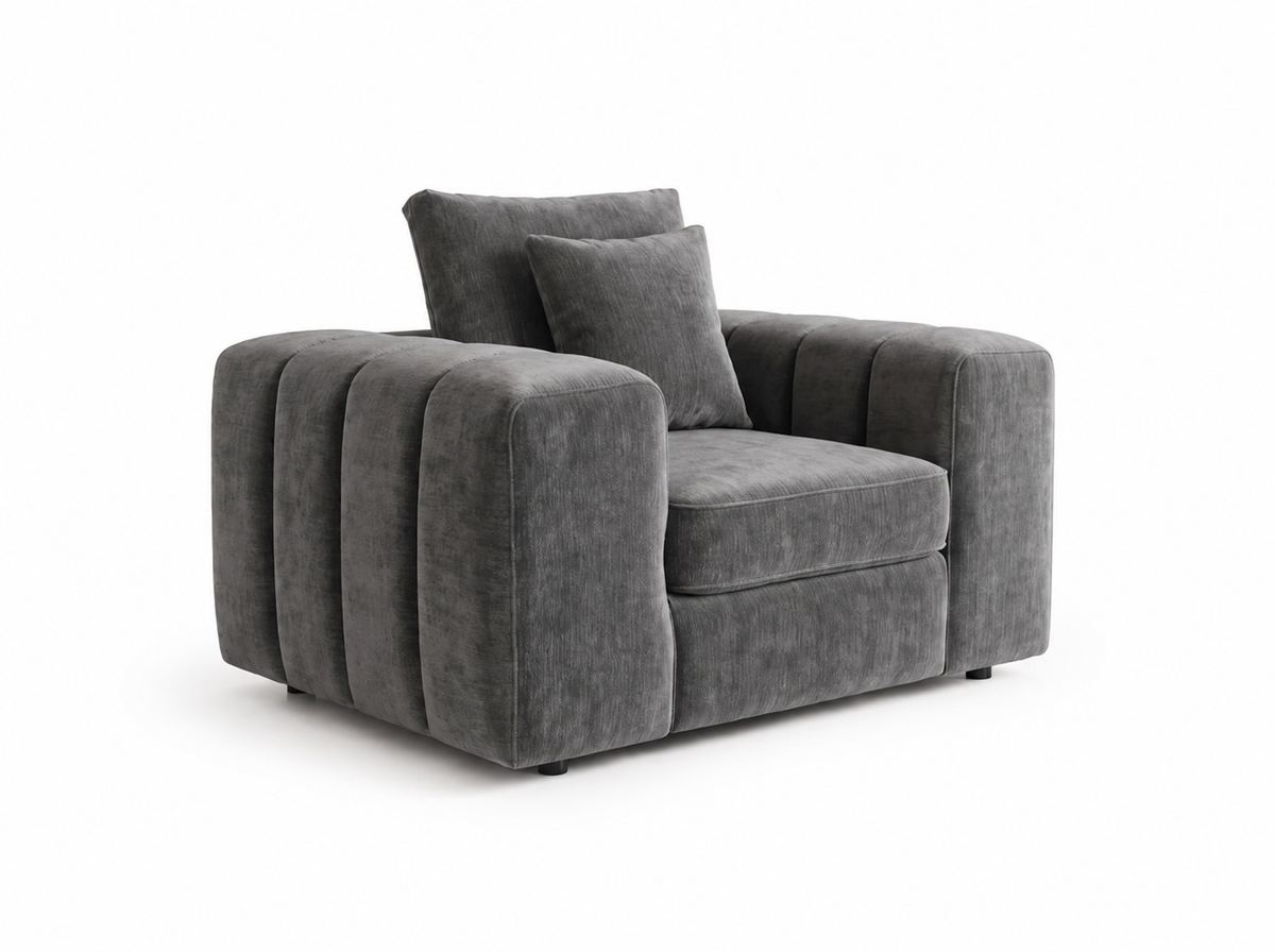 A modern gray upholstered armchair with a chunky, rounded design, vertical channel detailing on the armrests, and two matching back cushions, shown on a plain white background.