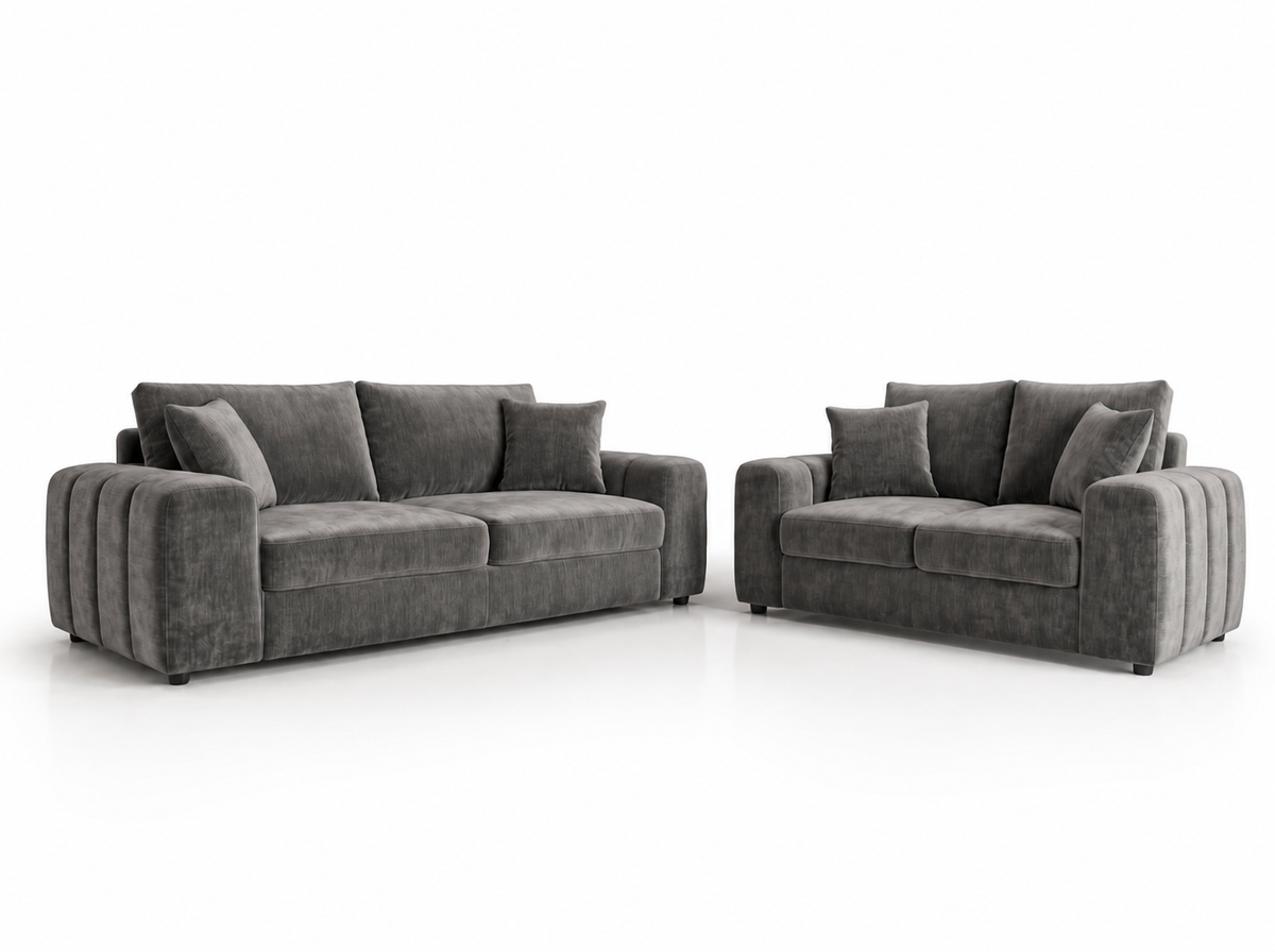 A dark gray velvet three-seater sofa and a matching two-seater loveseat with matching throw pillows, shown on a clean white background.