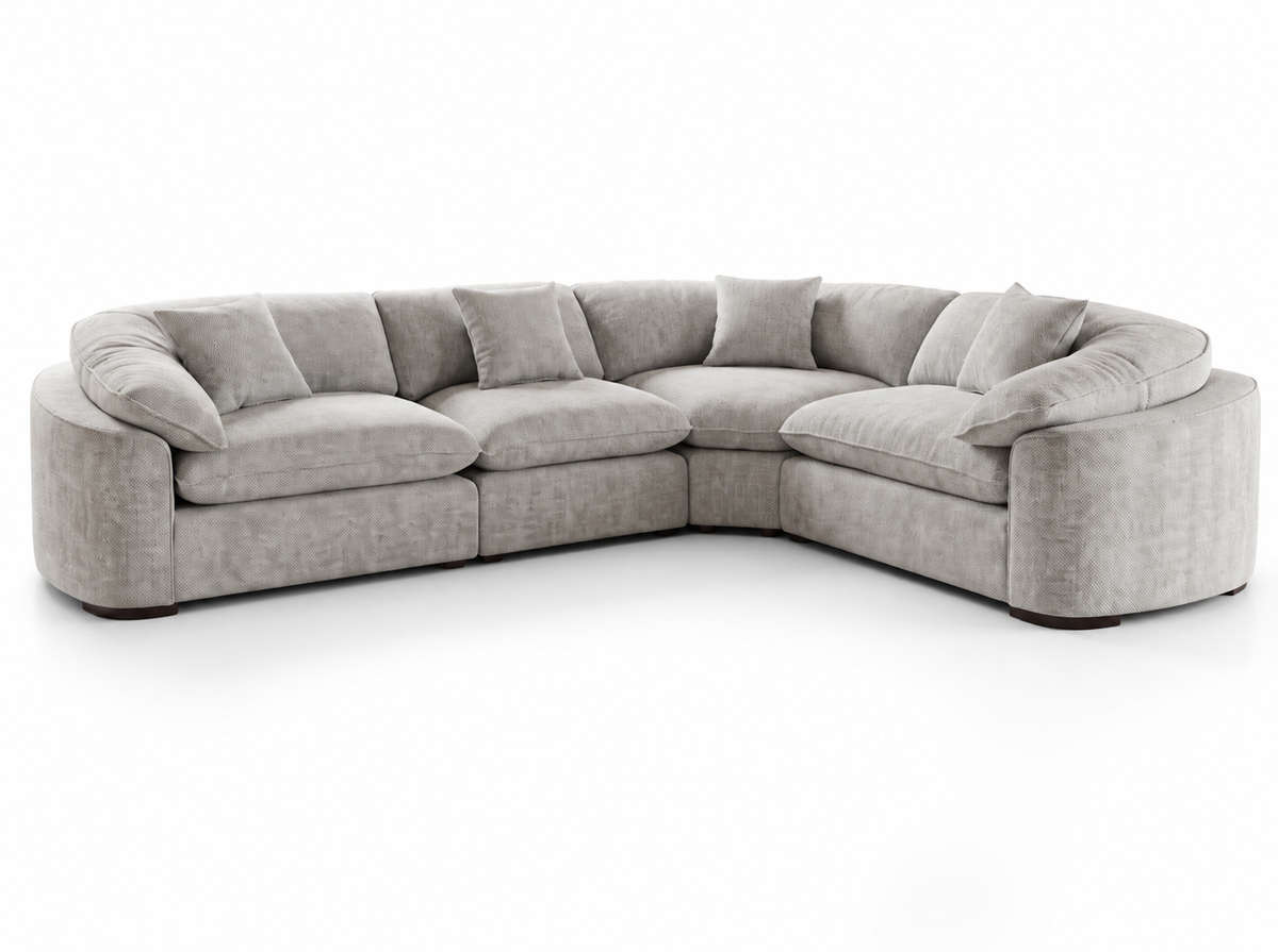 A light gray upholstered sectional sofa with a curved left side and a right armrest, shown on a clean white background.
