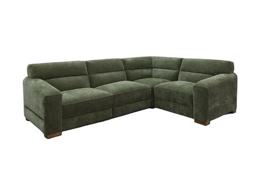Green sectional sofa on a white background