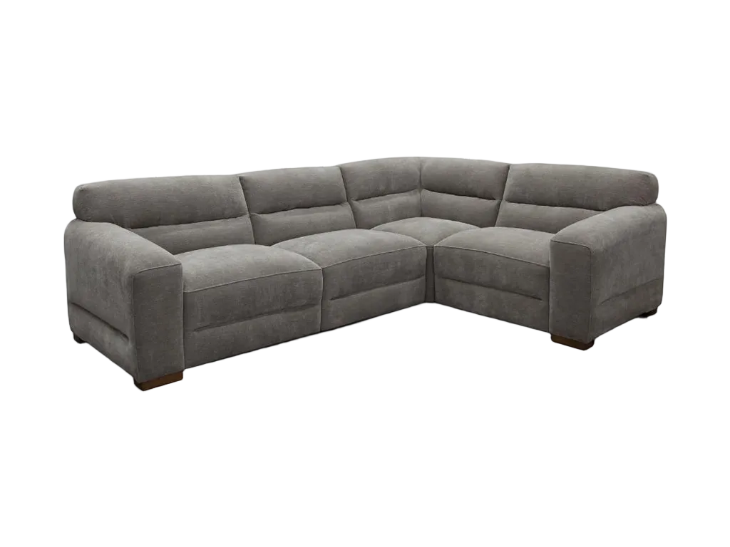 Gray sectional sofa in a living room with large windows and a rug.